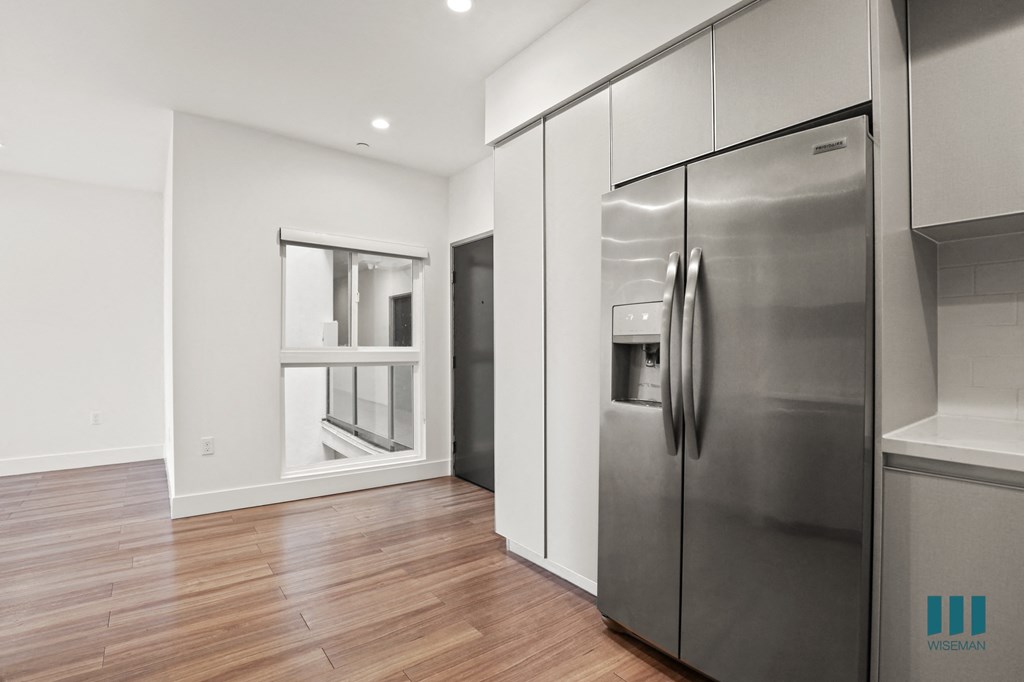 Kitchen with Full-Size Stainless-Steel Refrigerator