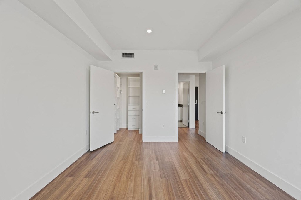 Bedroom with Walk-In Closet with Built-In Organizers