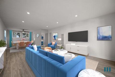 A living room with a blue couch and a television.