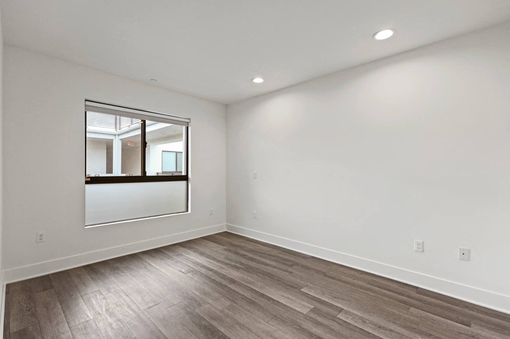 Bedroom with Recessed Lighting and Window