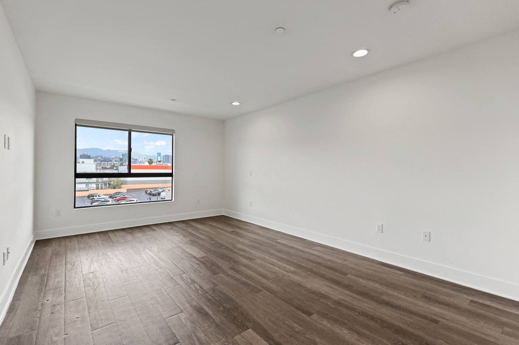 Living Room with Recessed Lighting and Vinyl Flooring