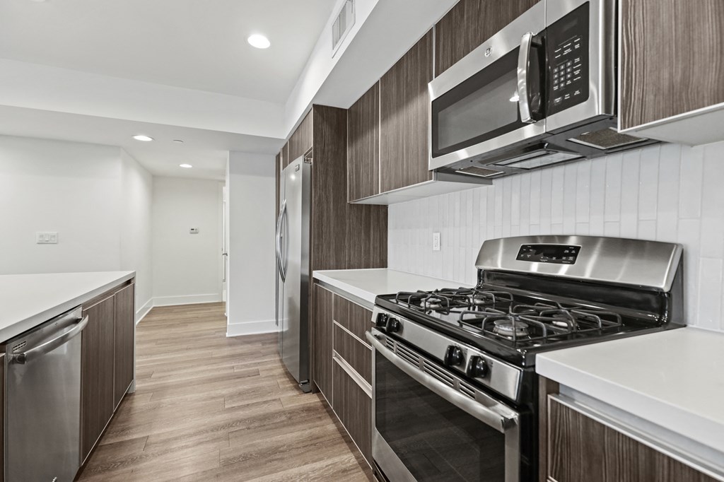 Kitchen with Stainless Refrigerator, Stove, and Microwave Oven