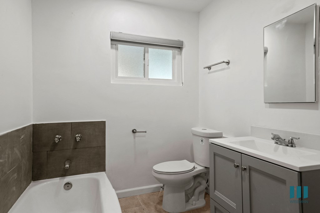Bathroom with Bathtub and Vanity with Cabinet Storage