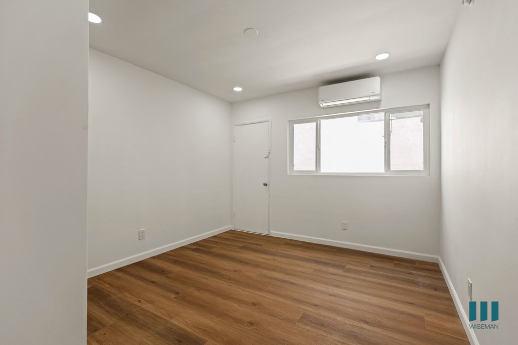 Bedroom with Windows, Vinyl Flooring, and Recessed Lighting