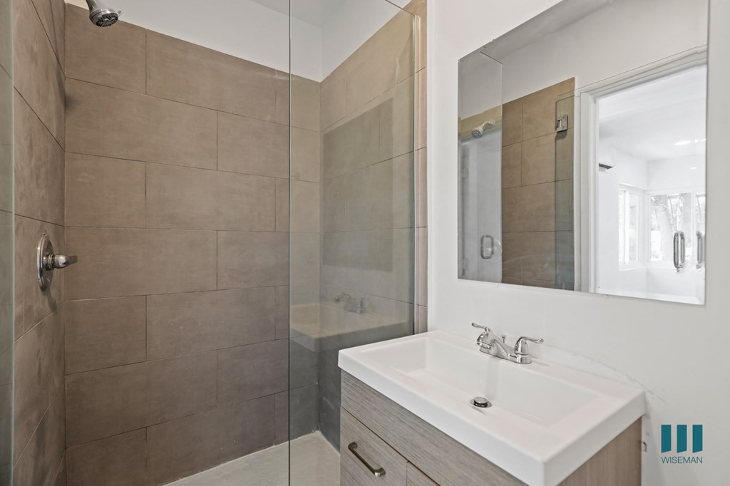 Bathroom with Walk-In Shower and Vanity Cabinet Storage
