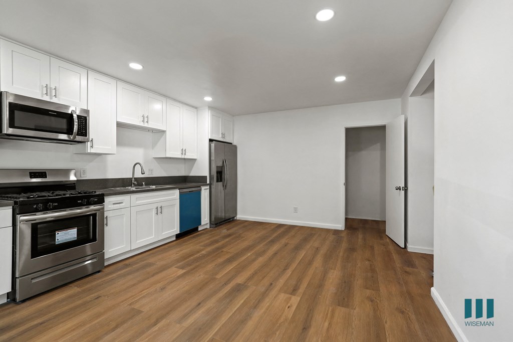 Kitchen with Stainless Refrigerator, Stove, Microwave Oven, and Dishwasher