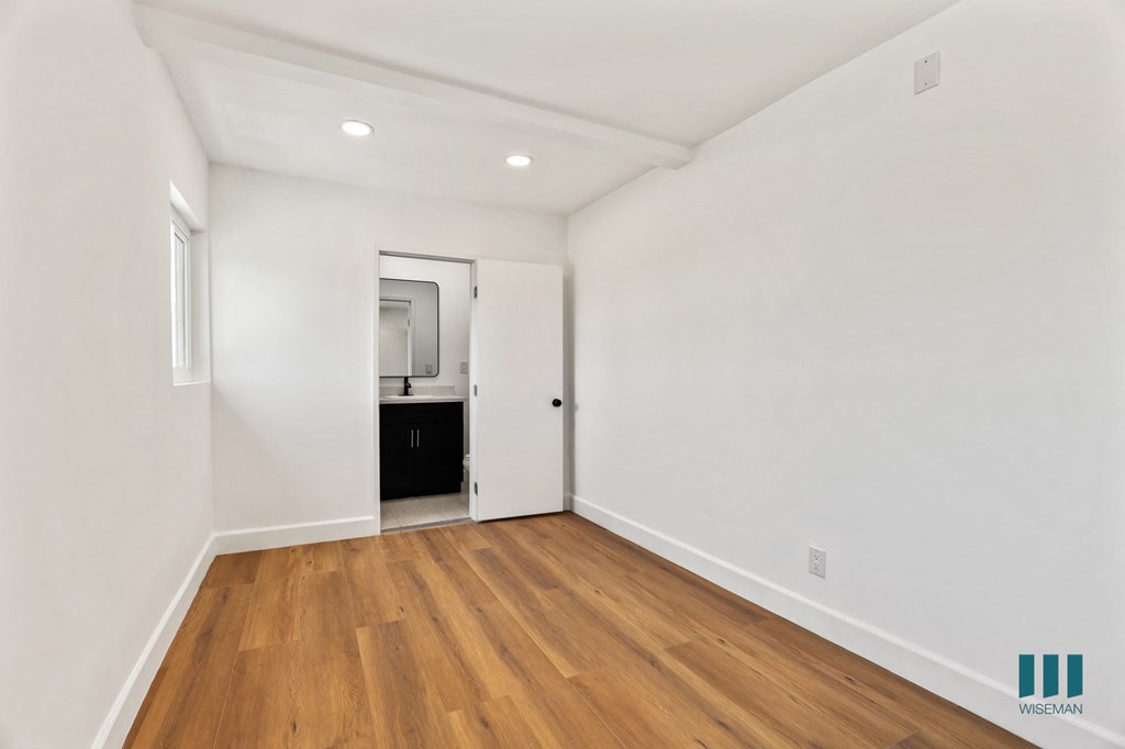 Bedroom with Recessed Lighting, Vinyl Flooring, and Bathroom