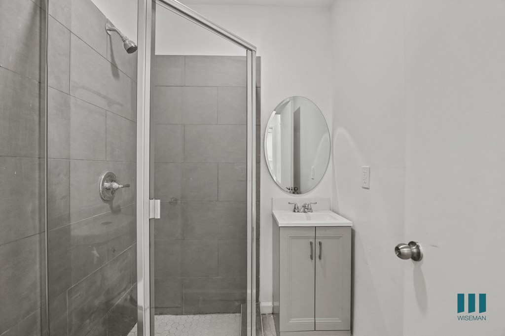 Bathroom with Stand-In Shower and Glass Door and vanity Cabinet Storage