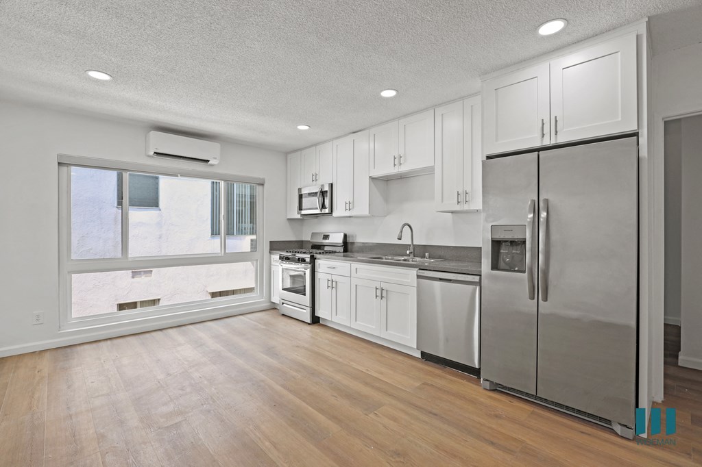 Kitchen with Stainless Refrigerator, Stove, Microwave Oven, and Dishwasher