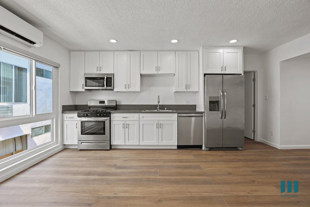 Kitchen with Stainless Refrigerator, Stove, Microwave Oven, and Dishwasher