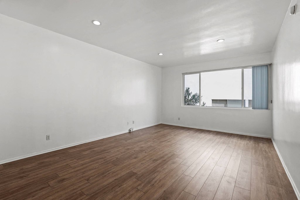 Bedroom with Vinyl Flooring, Recessed Lighting, and Large Window