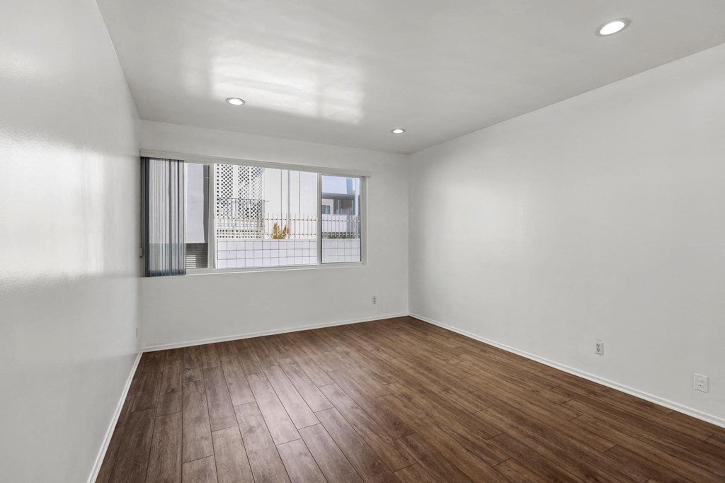 Bedroom with Vinyl Flooring, Recessed Lighting, and Large Window