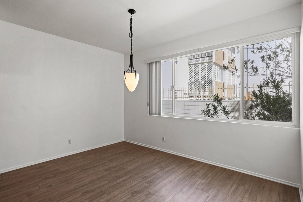 Dining Room with Large-Size Window and Vinyl Flooring