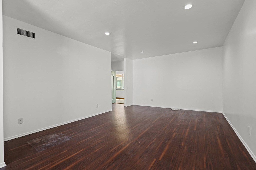 Spacious Living Room with Recessed Lighting and Vinyl Flooring