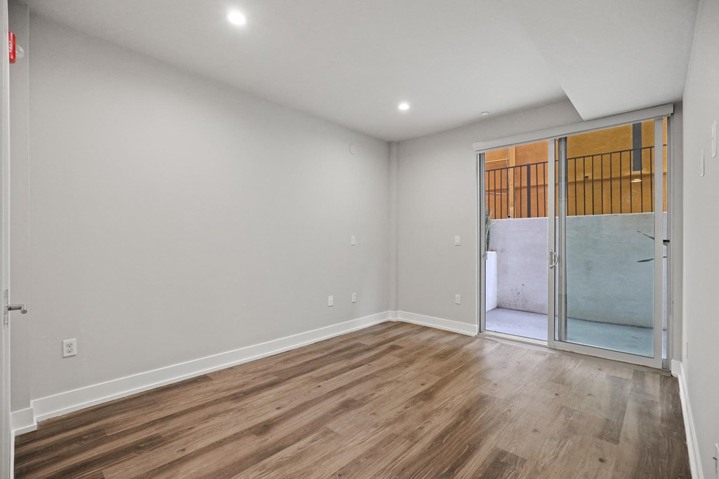Bedroom with Mirrored Closet, Vinyl Flooring, and Balcony with Private Entrance