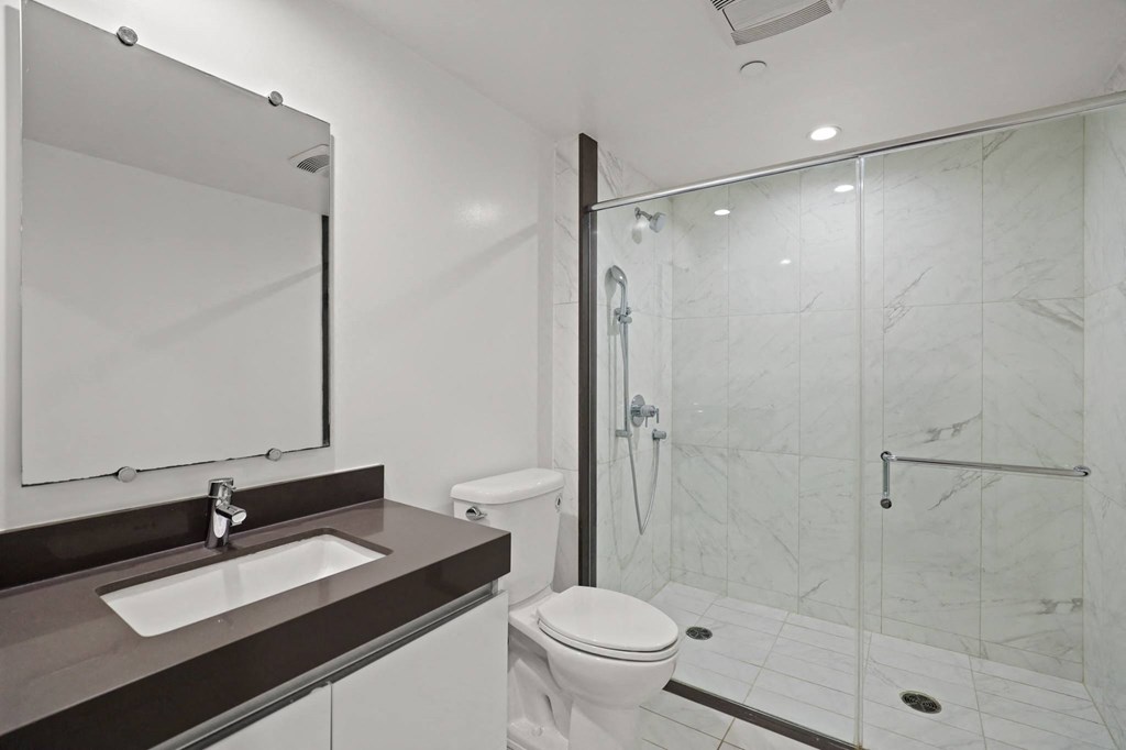 Bathroom with Walk-In Shower & Glass Door, and Vanity Cabinet Storage