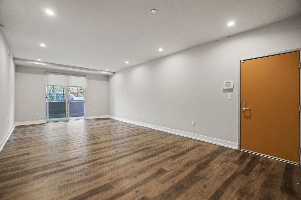 Living Room with Recessed Lighting, Vinyl Flooring, and Patio
