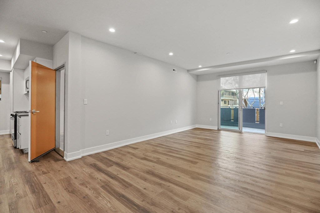Living Room with Recessed Lighting, Vinyl Flooring, and Patio with Roll-Down Shades