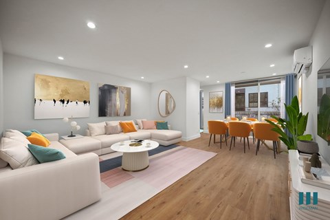 a living room and dining room with couches and a table