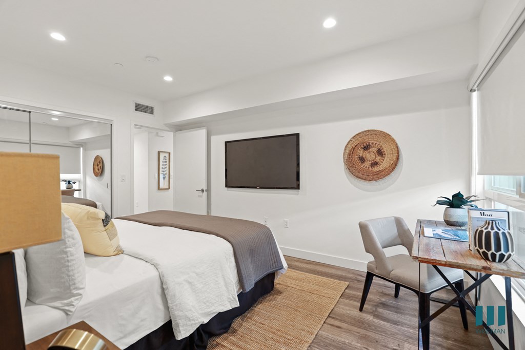 Bedroom with Mirrored Closet, Vinyl Flooring, and Recessed Lighting