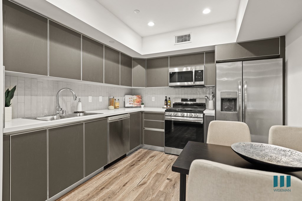 Kitchen with Stainless-Steel Refrigerator, Stove, Microwave Oven, and Dishwasher