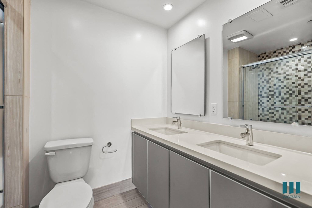 Bathroom with Double-Sink Vanity and Cabinet Storage