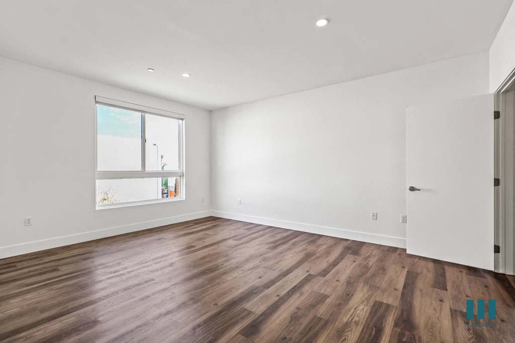 Large-Size Bedroom with Vinyl Flooring and Windows