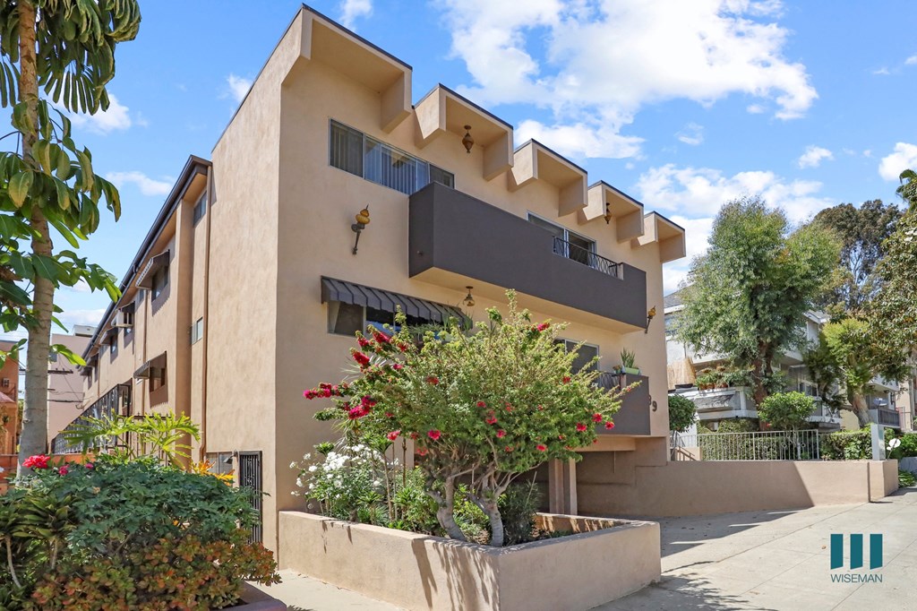 Sidewalk View of Alfred Atlas by Wiseman