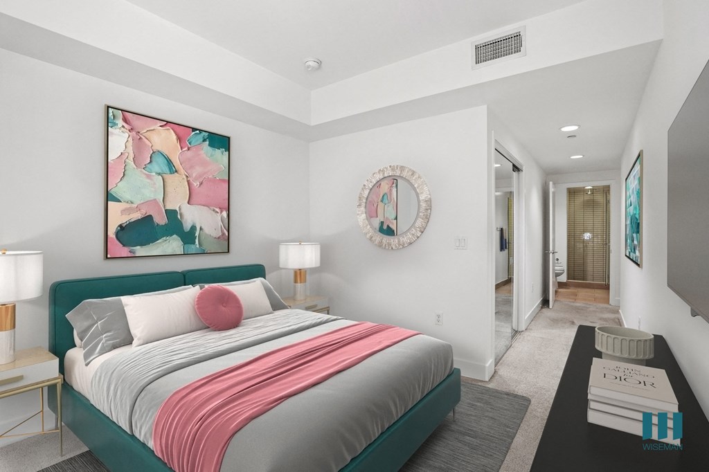 Bedroom with Mirrored Closet and Bathroom