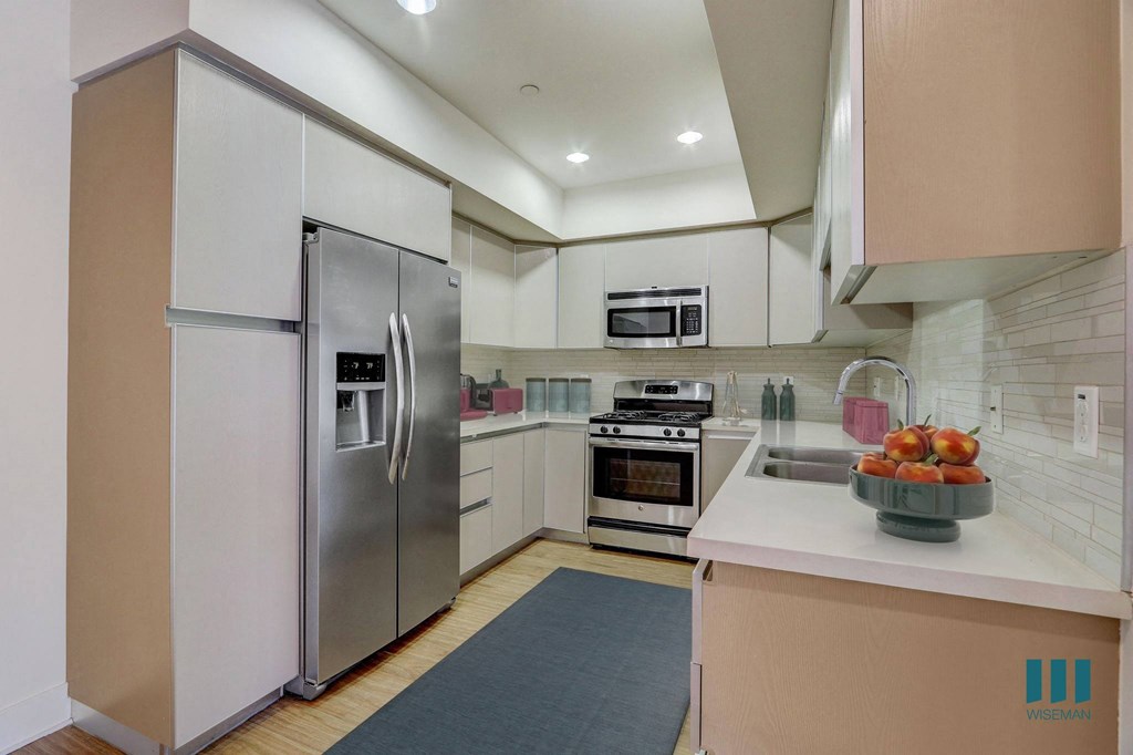 Full-Size Kitchen with Stainless-Steel Appliances and Ample Cabinet Storage Full-Size Kitchen with Stainless-Steel Appliances and Ample Cabinet Storage