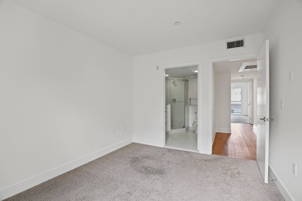 Bedroom and a Bathroom with a Stand-Up Shower
