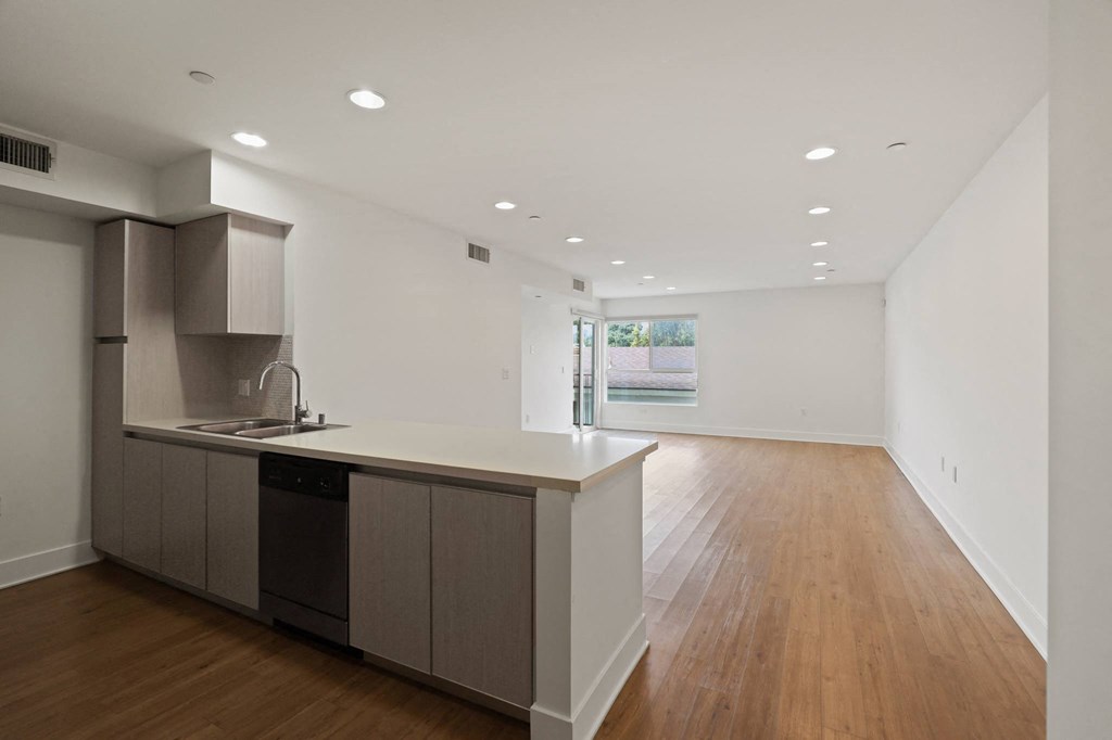 Open-Concept Floor Plan with Recessed Lighting, Vinyl Flooring, and Patio