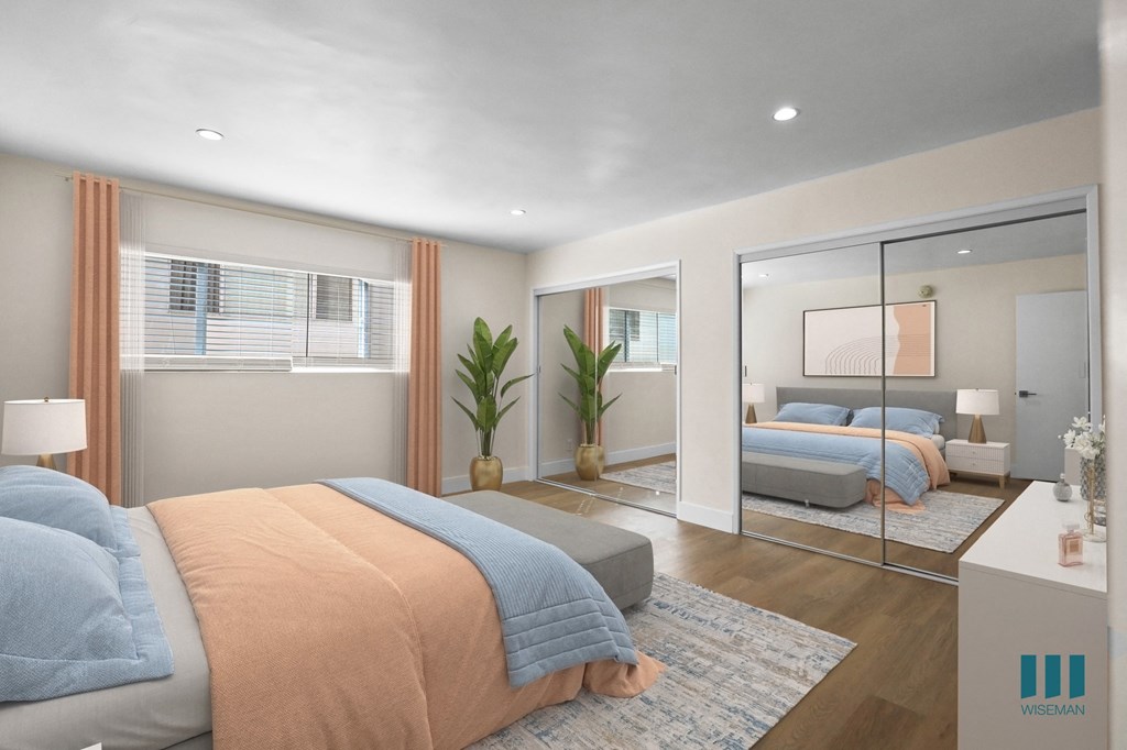 Bedroom with Two-Mirrored Closets, Vinyl Flooring, and Recessed Lighting