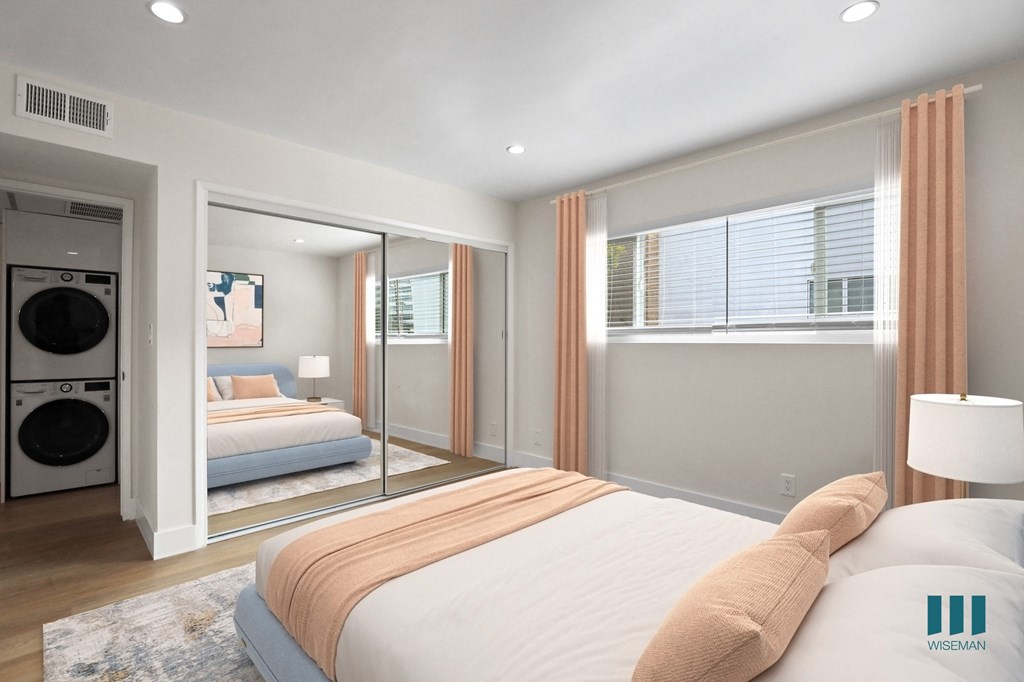 Bedroom with Large-Size Window and Hallway Closet with In-Suite Washer and Dryer