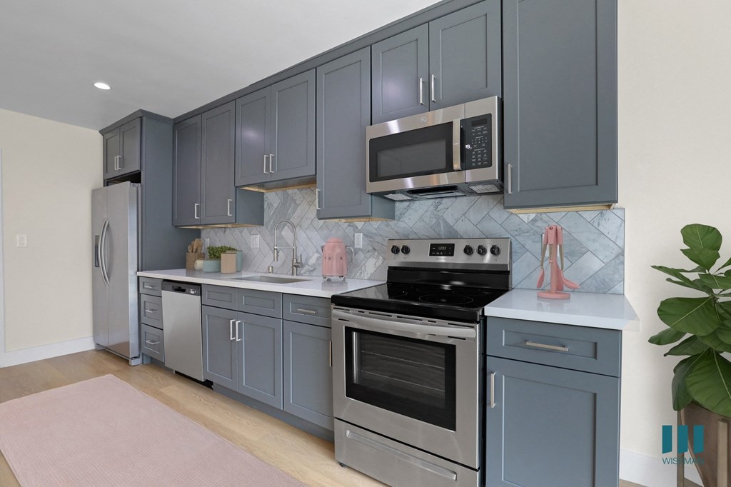 Kitchen with Stainless-Steel Refrigerator, Stove, Dishwasher, and Microwave Oven