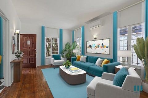 A living room with a blue couch and a coffee table.