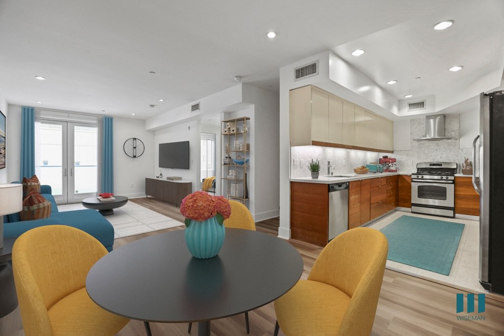 Open-Concept Kitchen, Dining, and Living Room with Patio