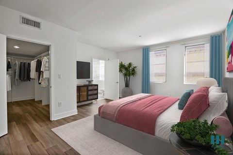 Bedroom with Walk-In Closet, Vinyl Flooring, and Bathroom