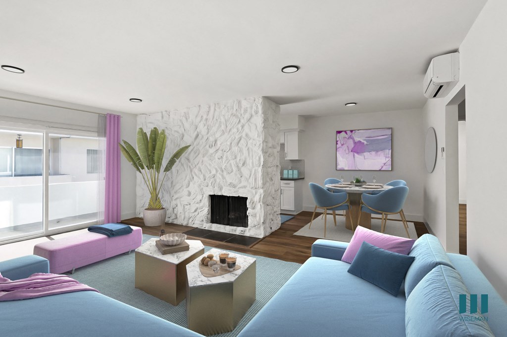 Open-Concept Living and Dining Room Space with Fireplace and Patio