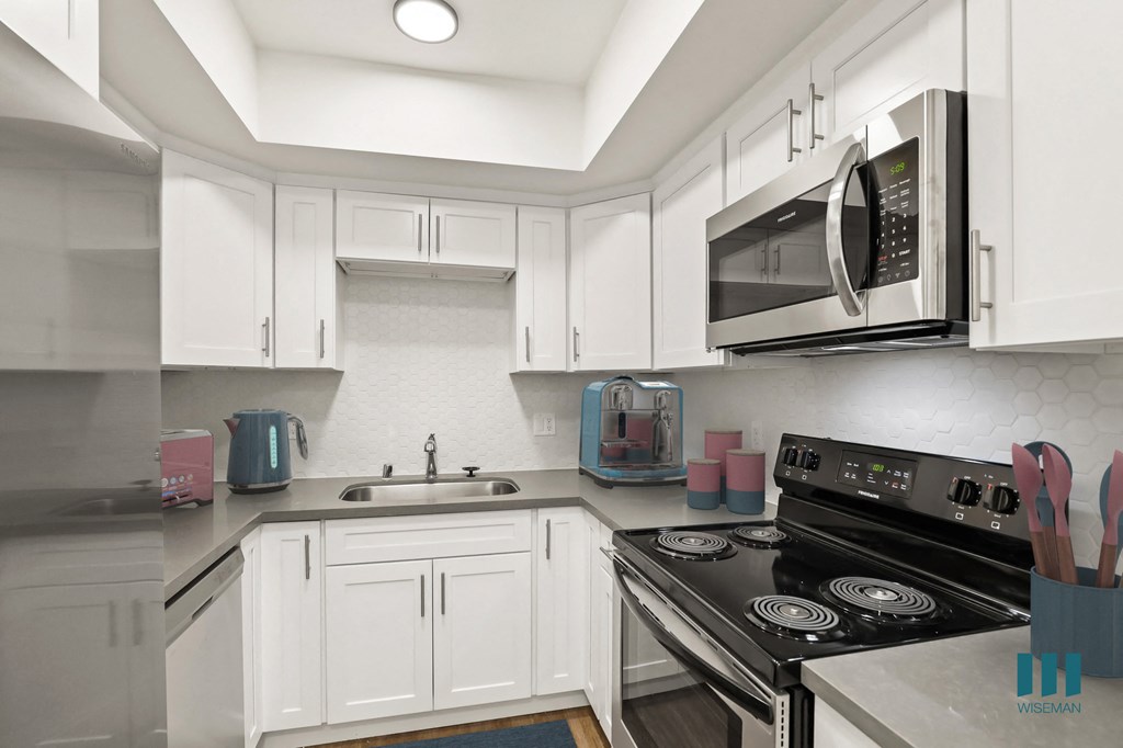 Kitchen with Stainless Steel Refrigerator, Stove, Microwave Oven, and Dishwasher