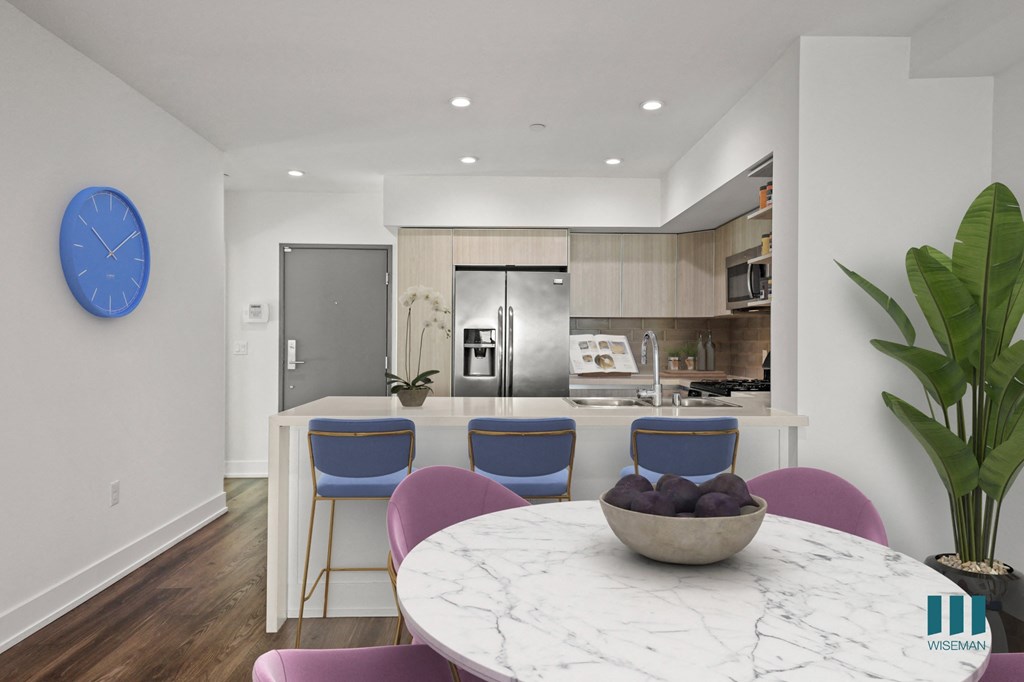 Front Entrance and Open-Concept Kitchen with Countertop Bar