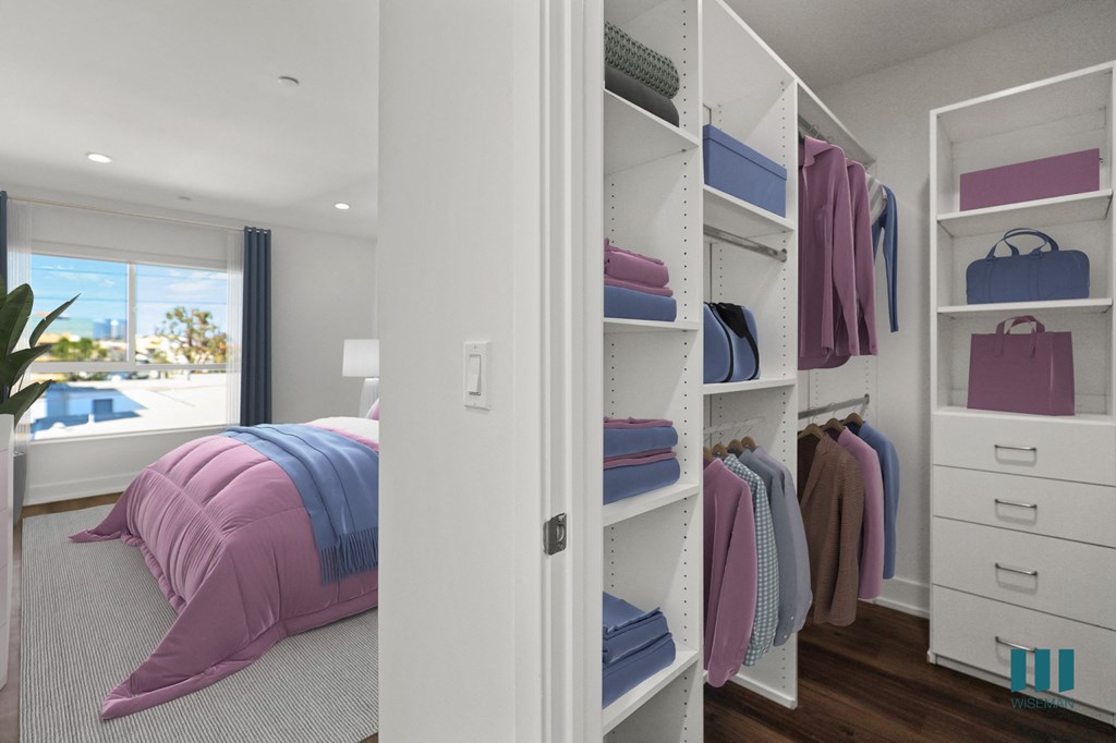 Bedroom with Vinyl Flooring, Recessed Lighting, and Walk-In Closet with Built-In Organizers