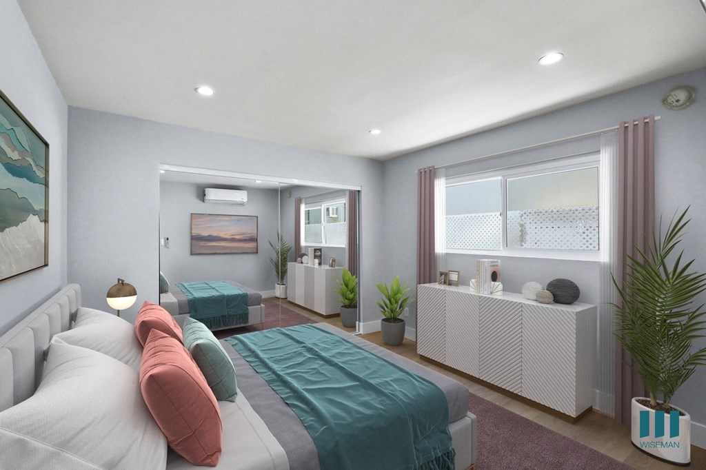 Bedroom with Mirrored Closet, Vinyl Flooring, Recessed Lighting, and Windows