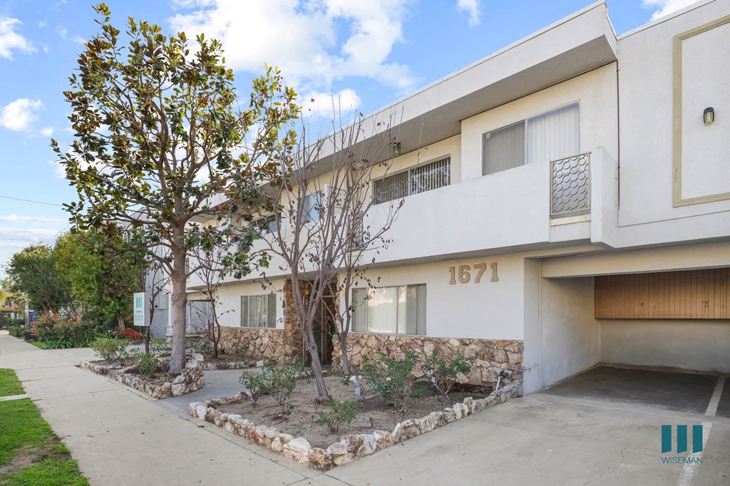 Sidewalk View of Colby West with Covered Resident Parking