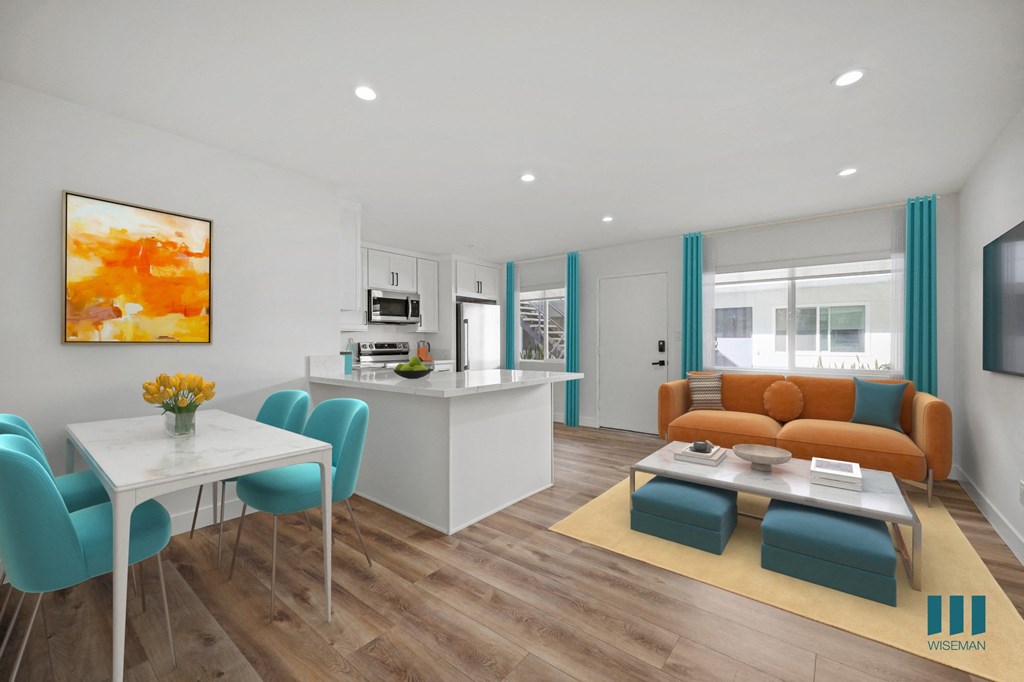 A modern living room with a dining table and chairs.