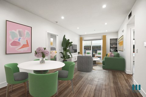 A modern living room with a white table and green chairs.