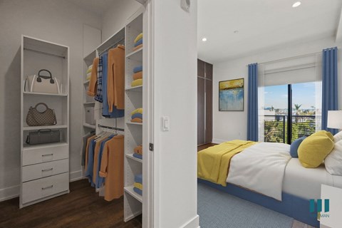 Bedroom with Walk-In Closet, Built-In Cabinets, and Balcony