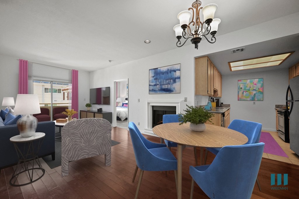 A living room with a dining table and chairs.