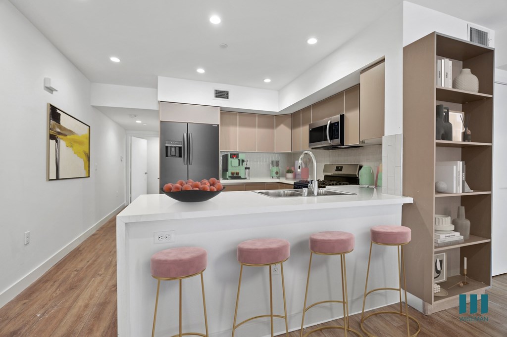 Open-Concept Kitchen with a Countertop Bar and Built-In Shelving