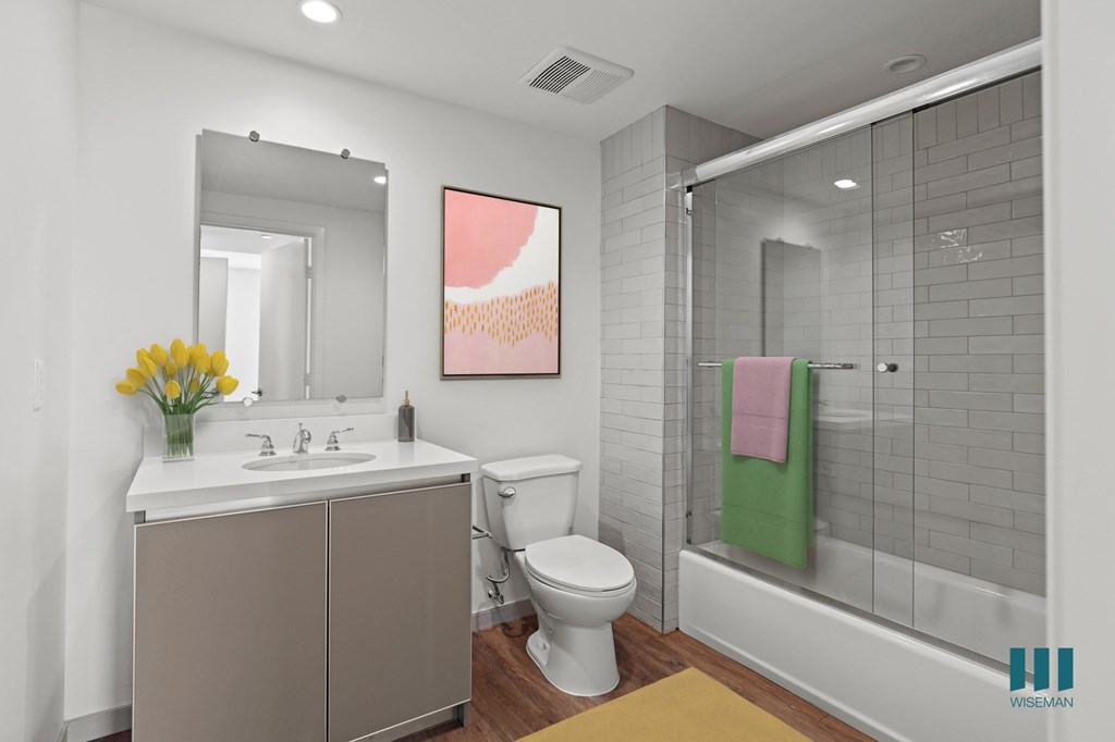 Bathroom with Shower-Bath with a Glass Door and Vanity Cabinet Storage